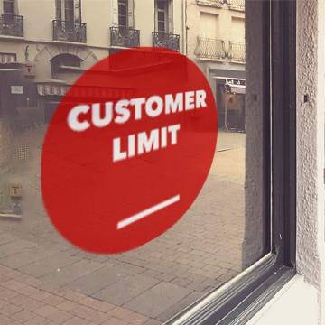 Red window cling with white "Customer limit" lettering - FoodSignPros